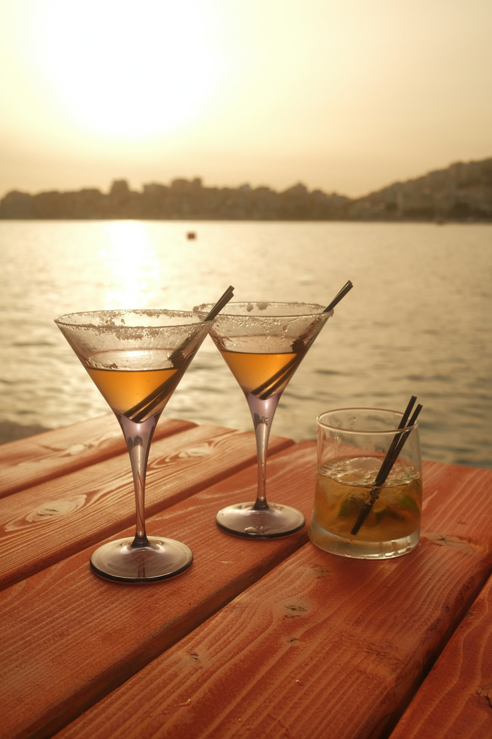 a couple of glasses that are sitting on a table