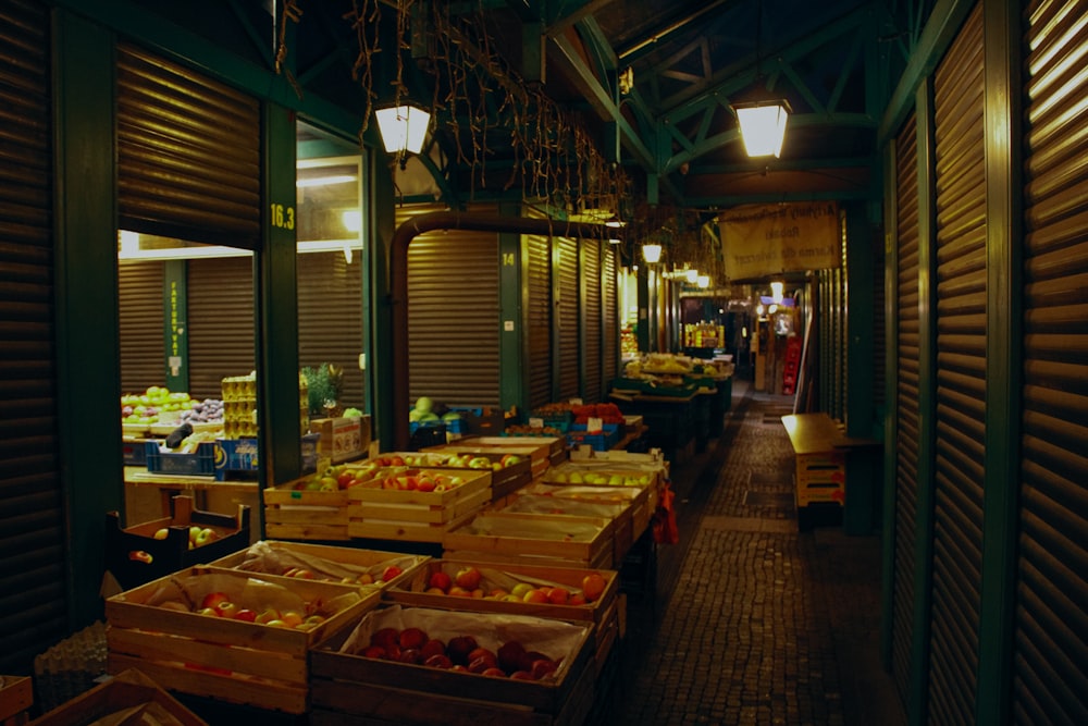 a grocery store filled with lots of boxes of fruit