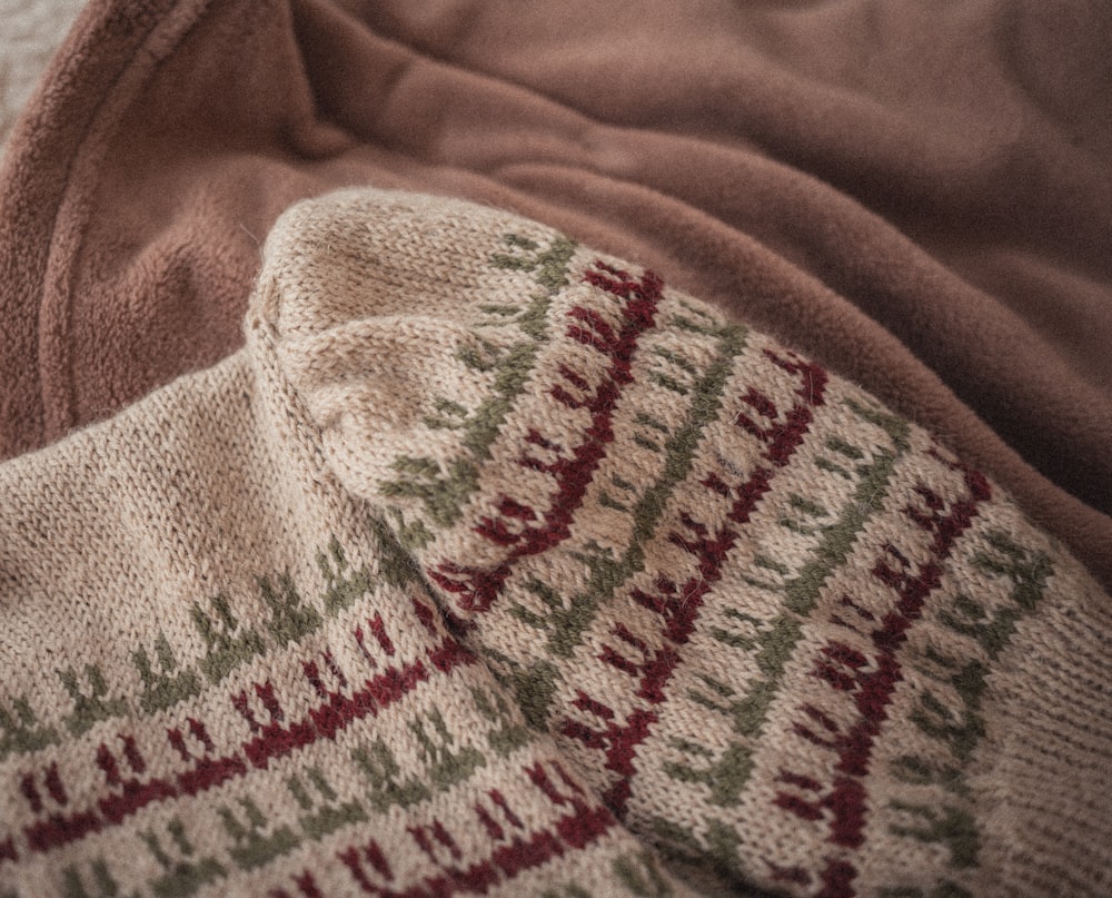 a close up of a blanket on a bed