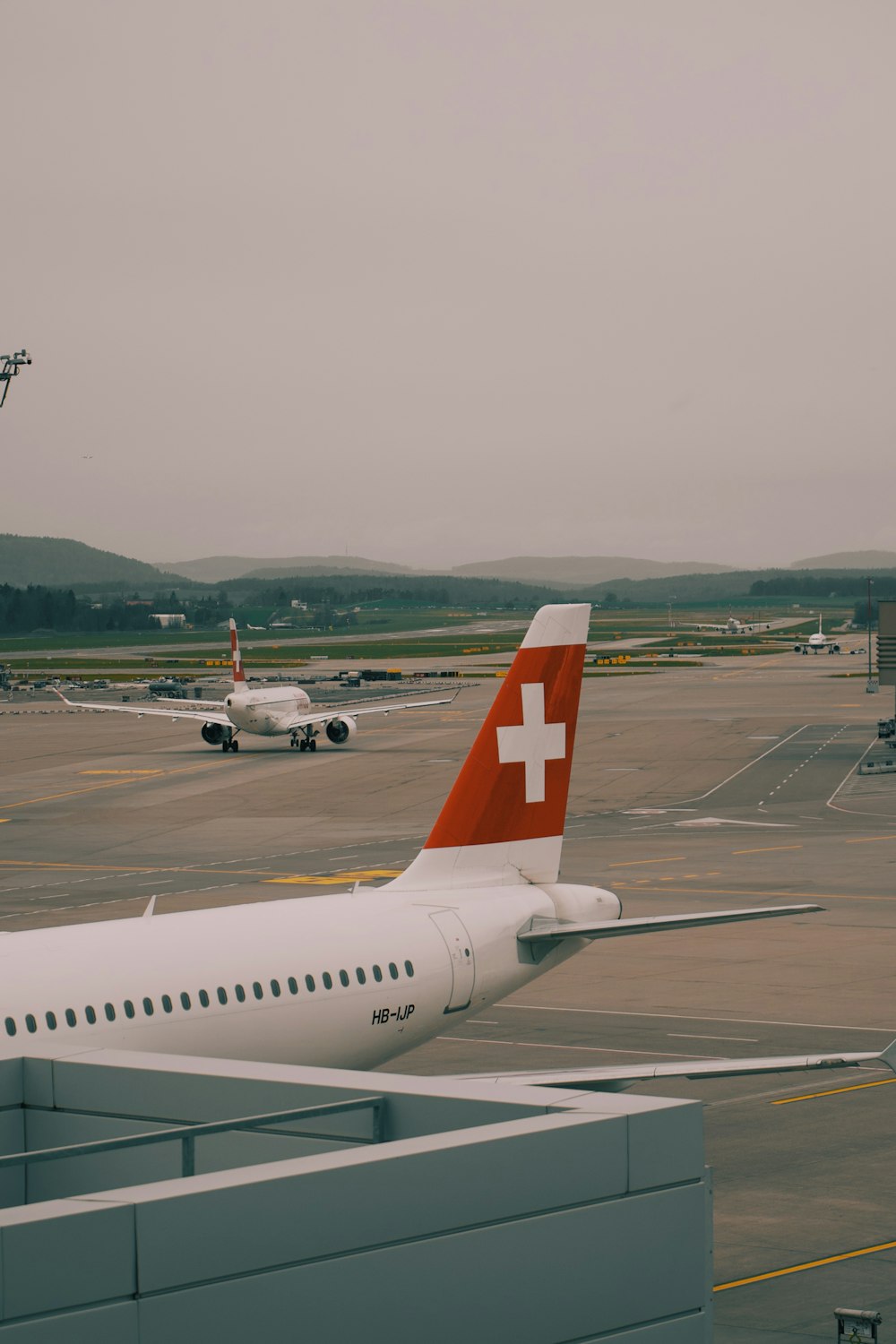 a large passenger jet sitting on top of an airport tarmac