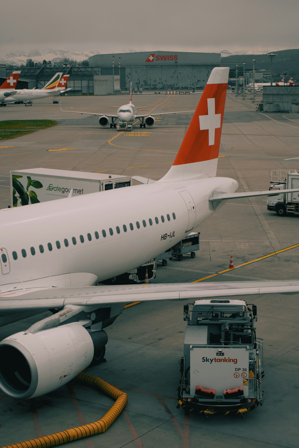 a large jetliner sitting on top of an airport tarmac