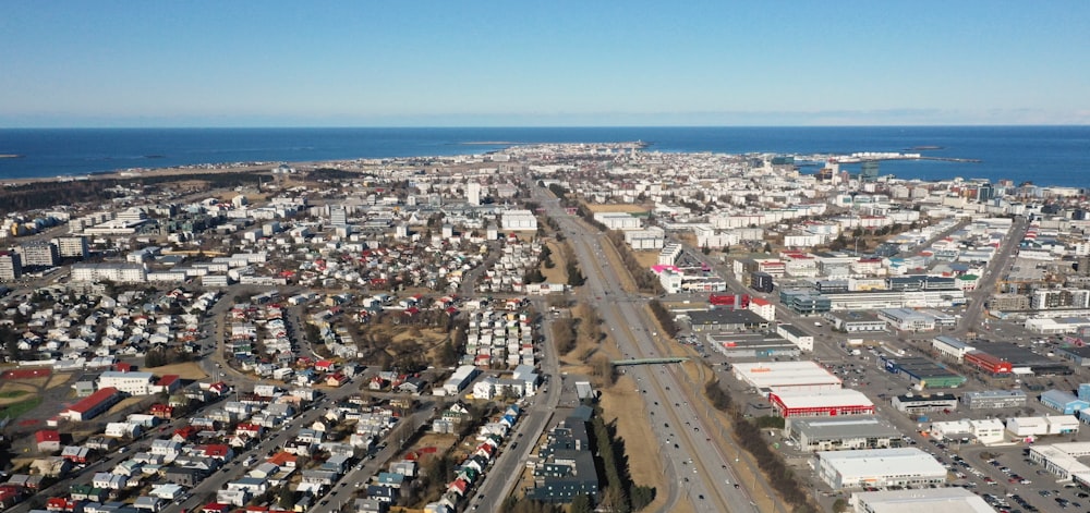 an aerial view of a city by the ocean