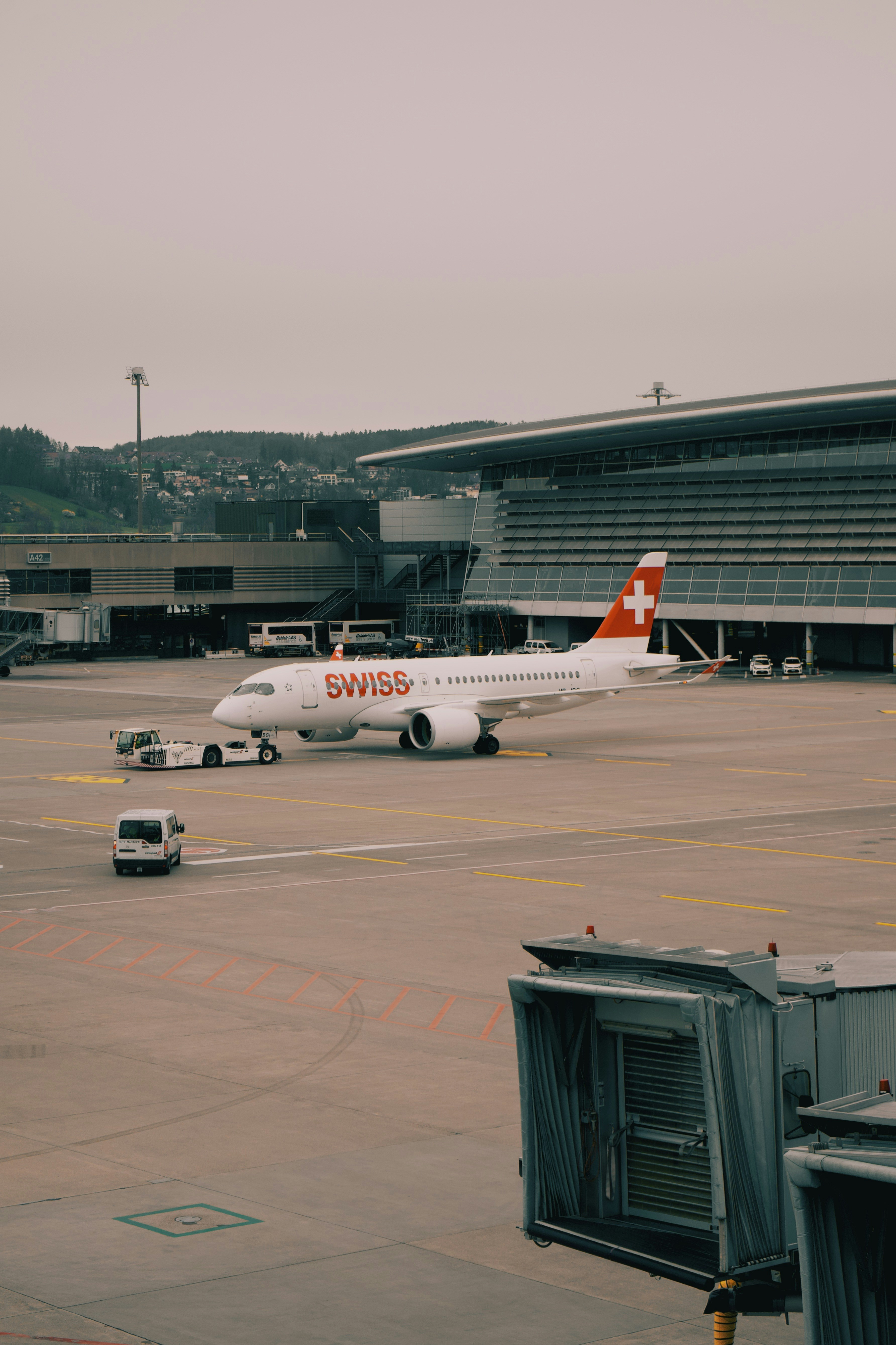 a large passenger jet sitting on top of an airport tarmac