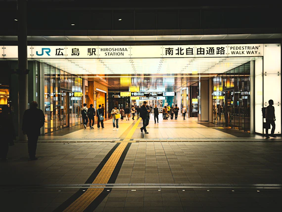 a group of people standing outside of a building