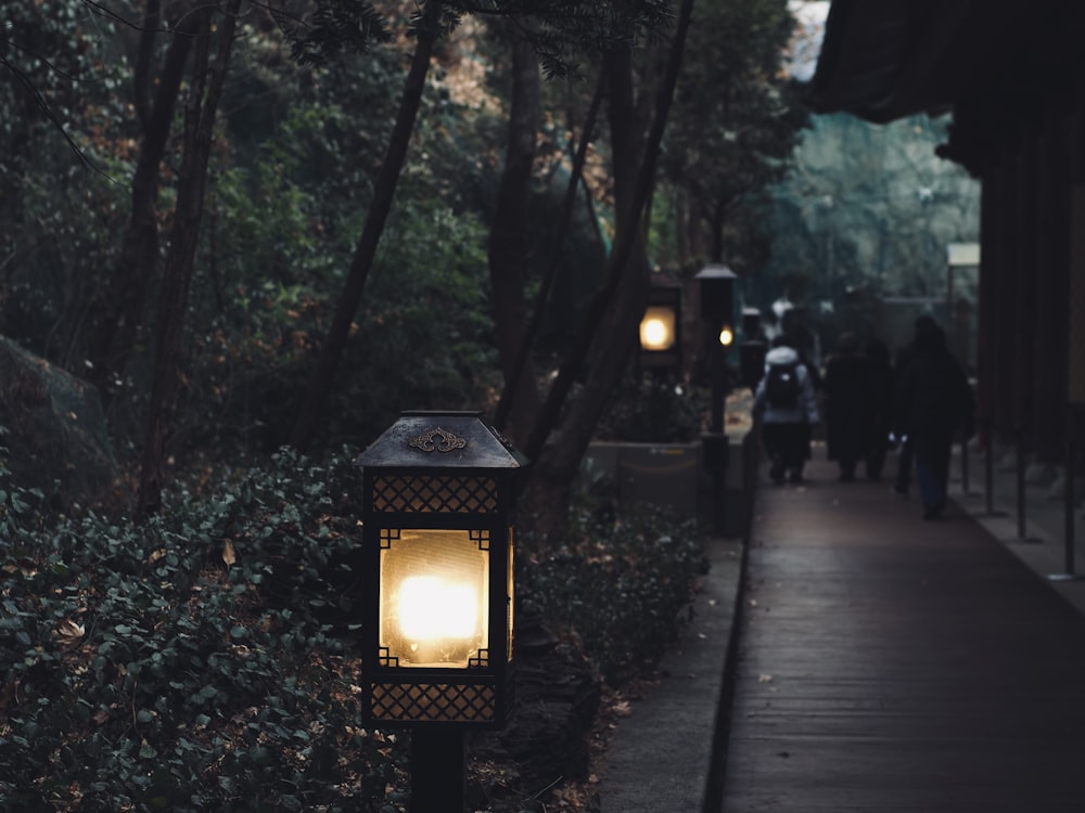 a street light sitting on the side of a road