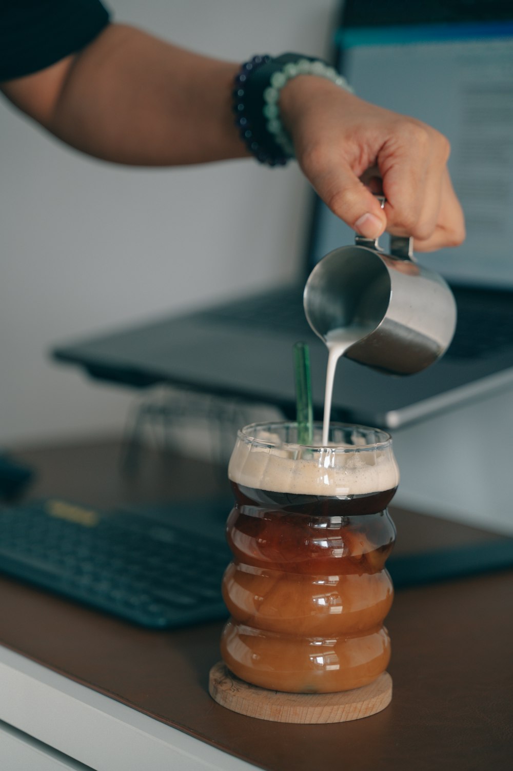 a person is pouring something into a jar