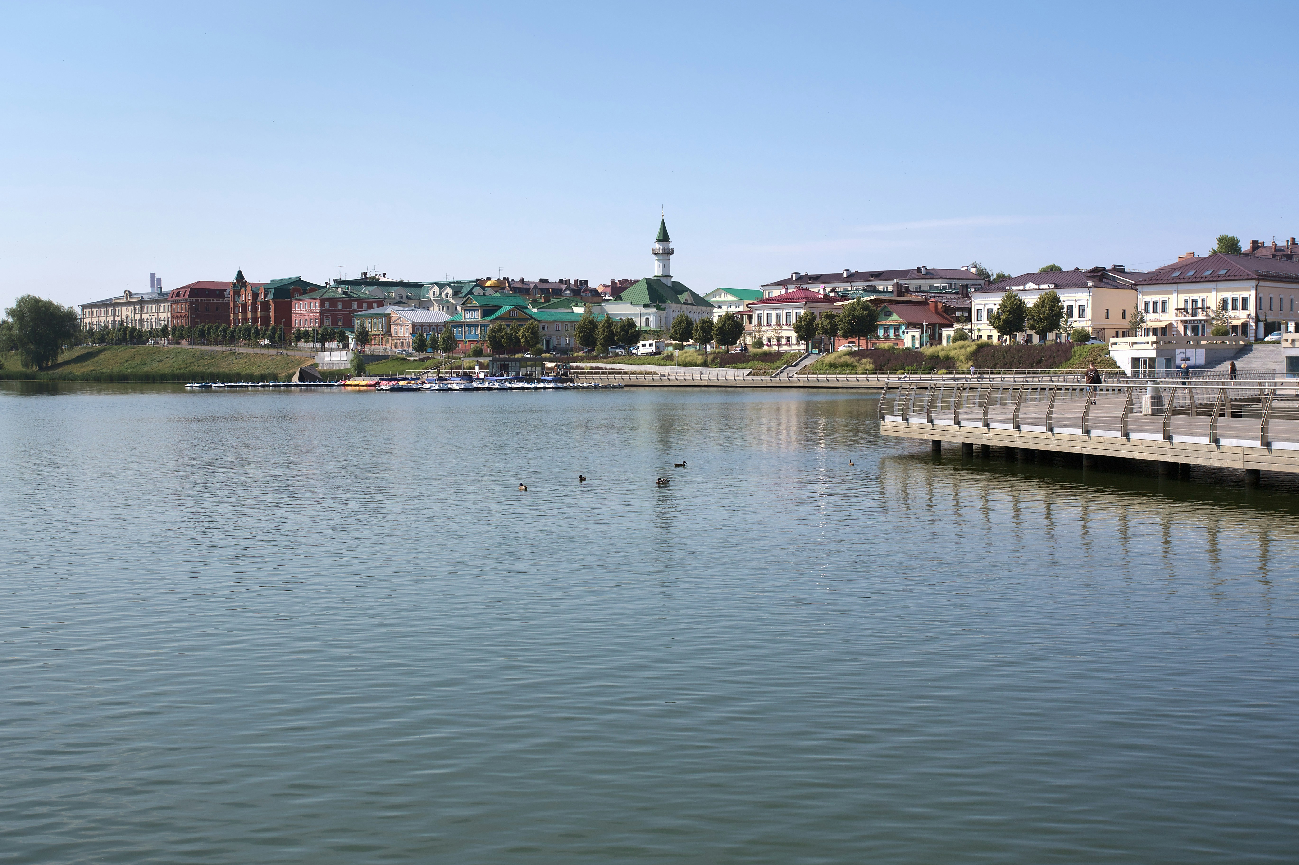 a body of water with a city in the background