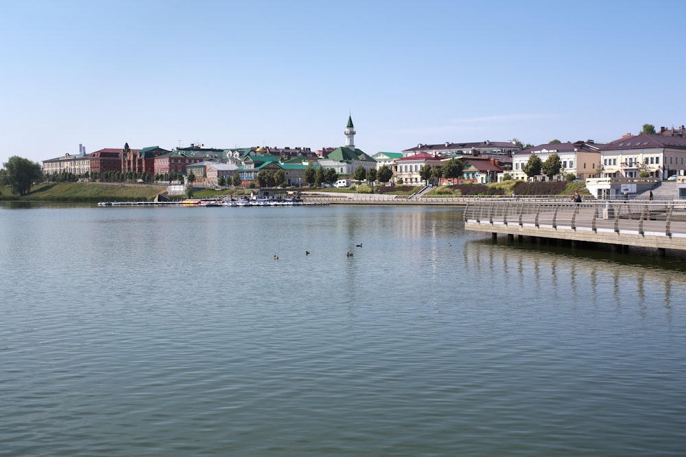 a body of water with a city in the background