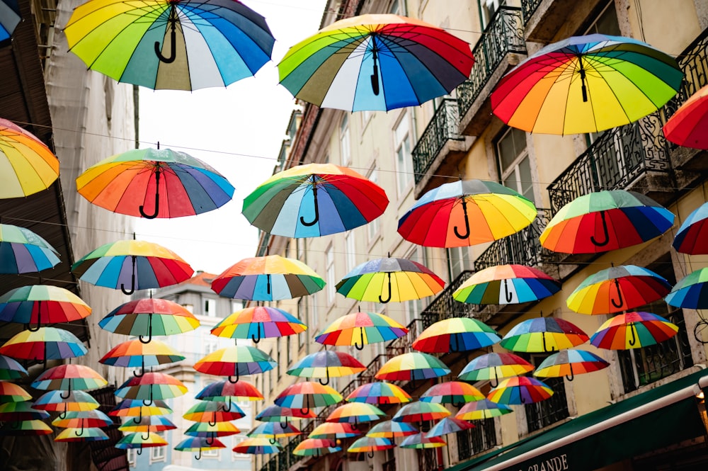a street filled with lots of colorful umbrellas