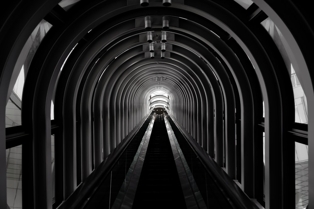 a long tunnel with a train going through it