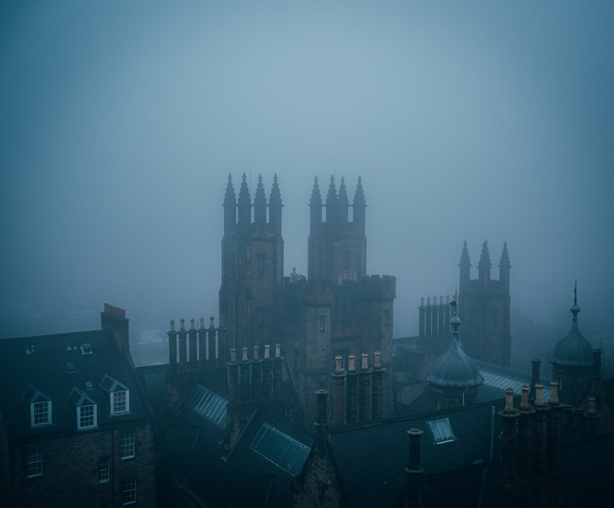 A foggy view over a historic city, dark and atmospheric