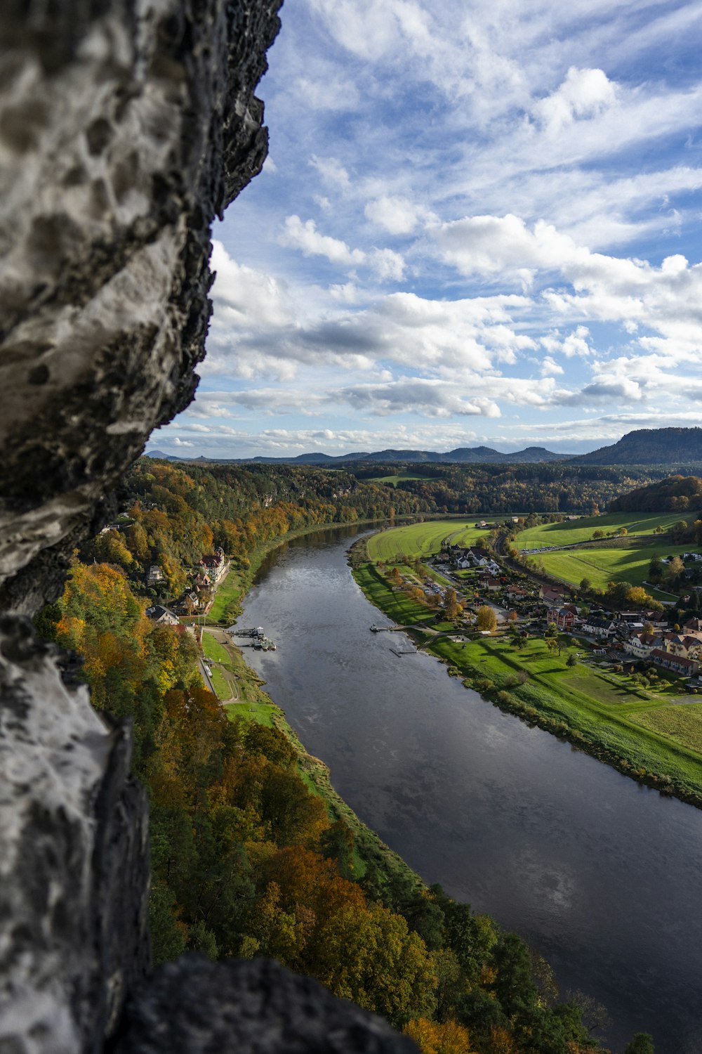 a river running through a lush green countryside