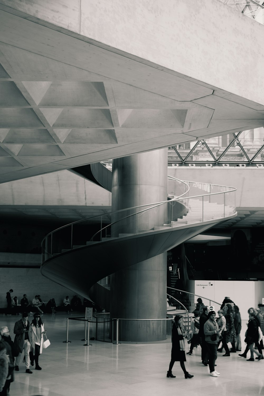 a group of people walking around a building