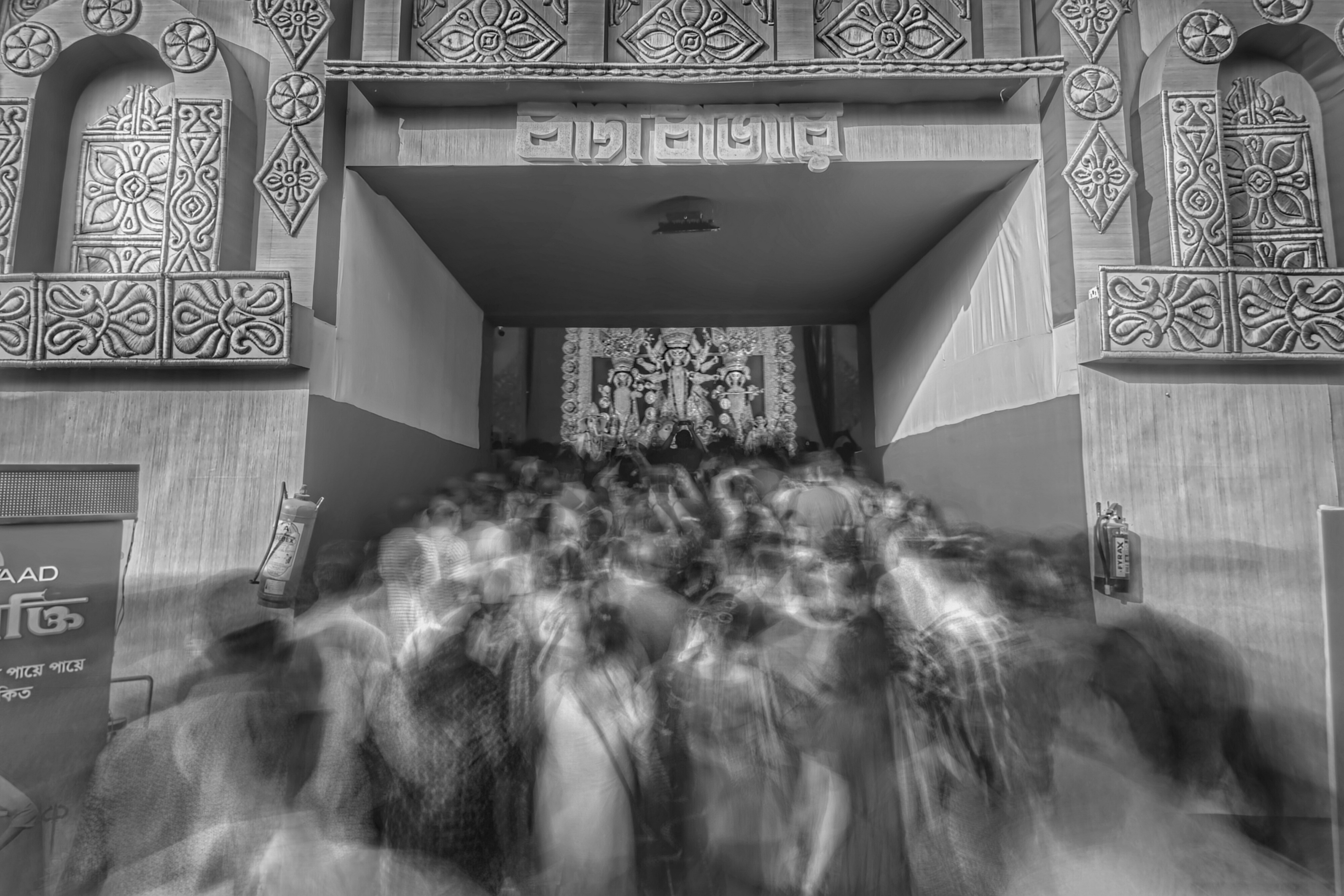 a black and white photo of a crowd of people