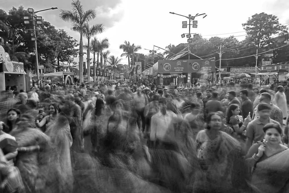 a large group of people walking down a street