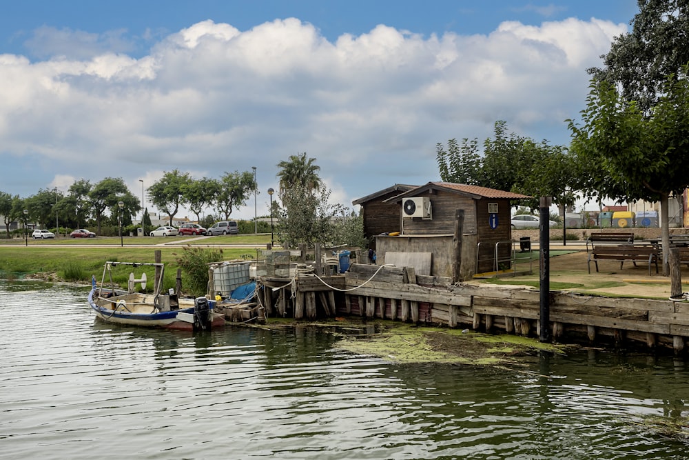 a small boat tied to a wooden dock