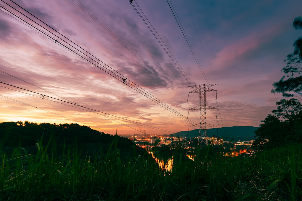 a view of a city from a hill at sunset