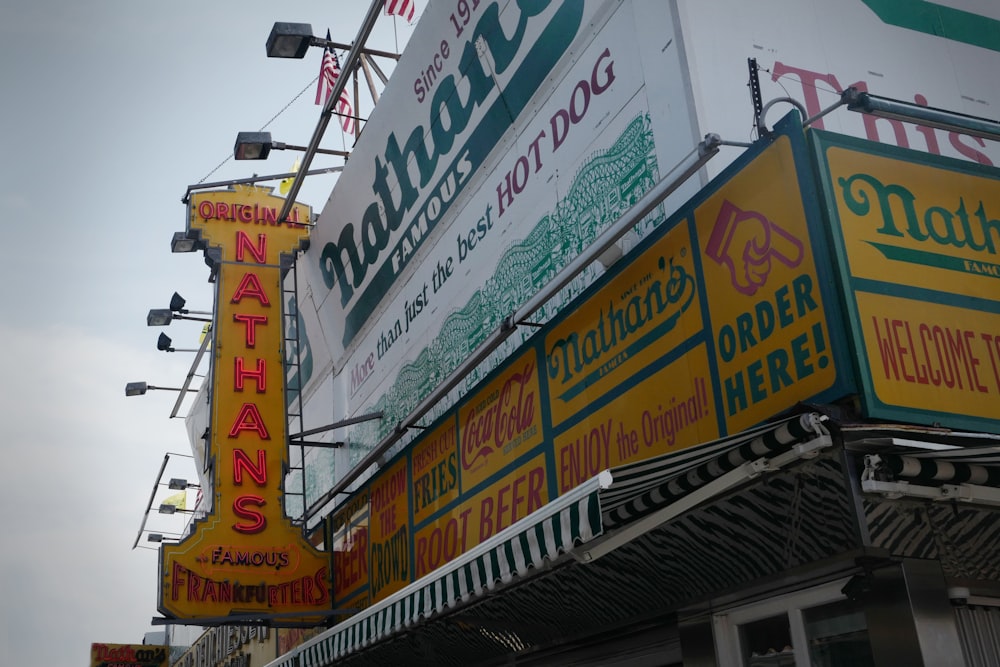 a bunch of signs that are on the side of a building