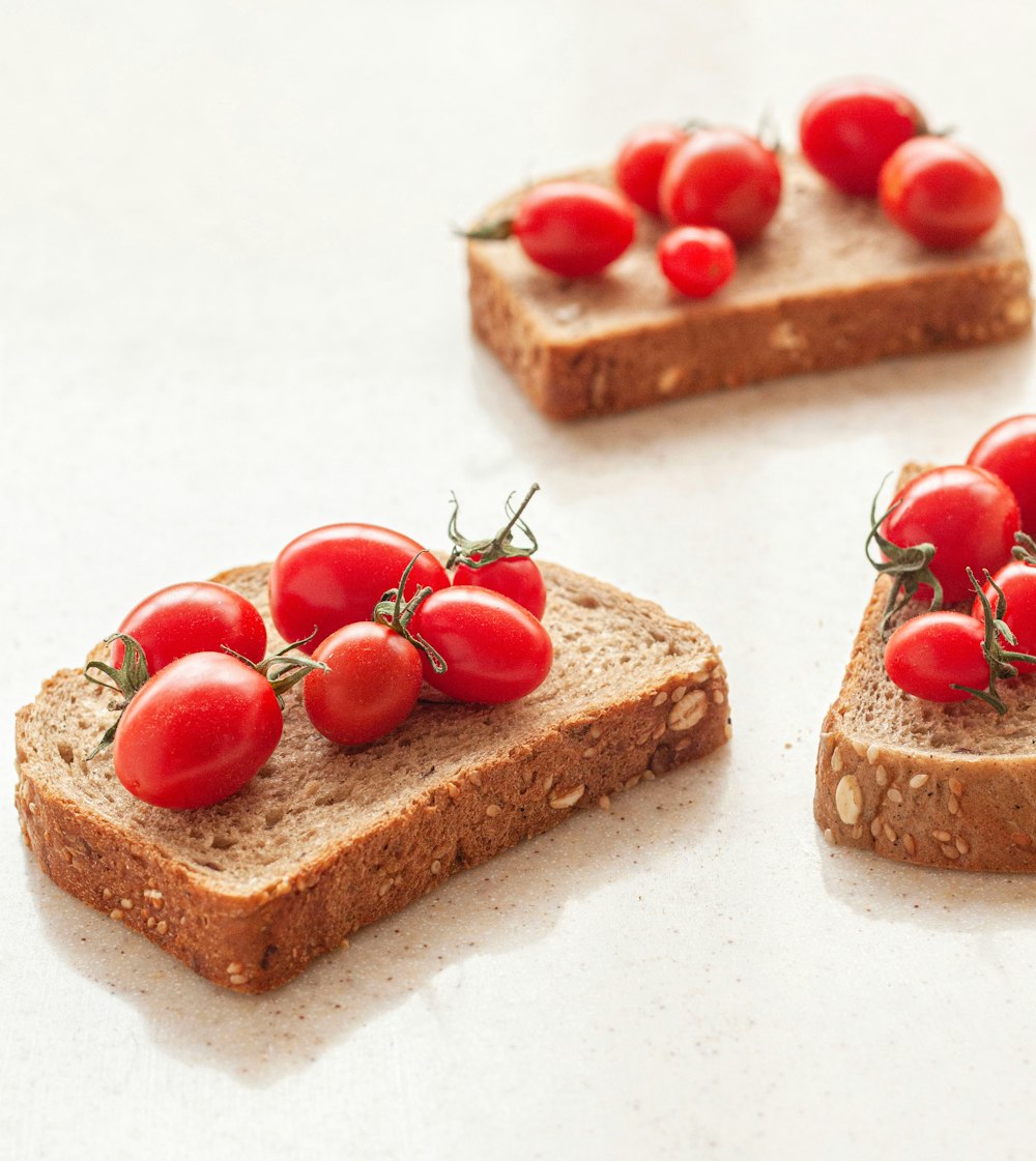 slices of bread with tomatoes on top of them