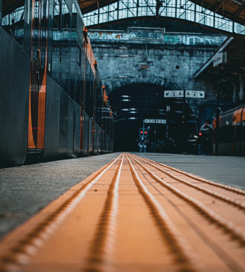 a train station with a train on the tracks