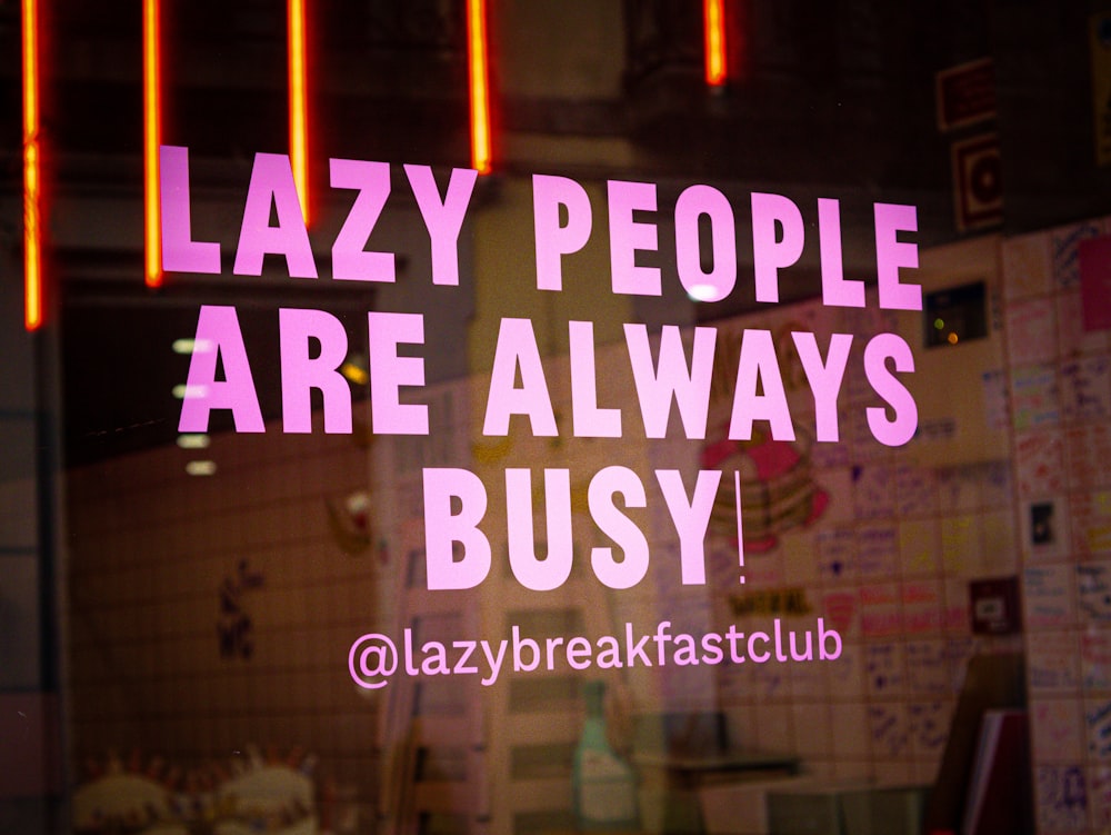 a sign that says lazy people are always busy