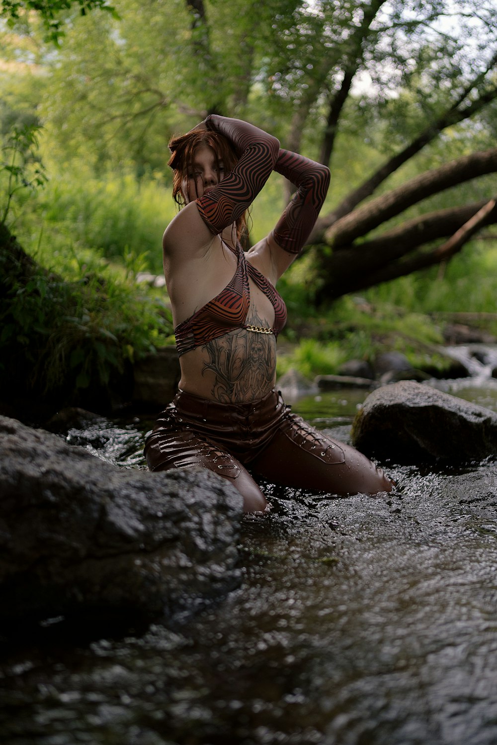 a woman in a bikini is sitting in the water