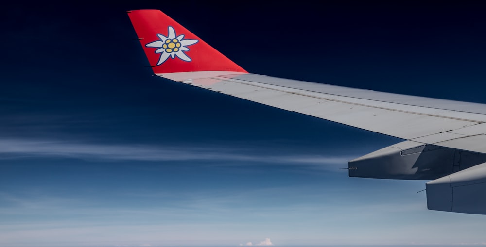 a view of the wing of an airplane in the sky