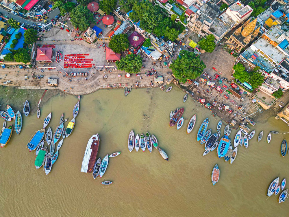 an aerial view of a harbor filled with boats