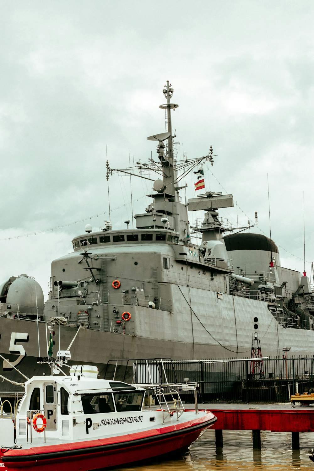 a large ship is docked at a dock