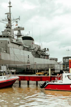 a large ship docked next to a dock