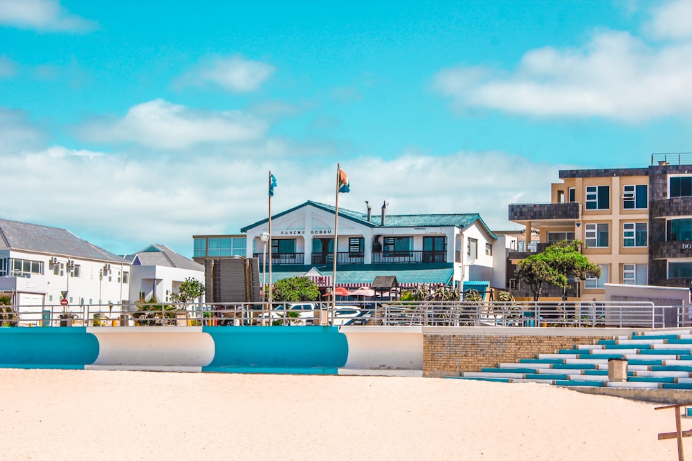 a row of beach chairs sitting on top of a sandy beach