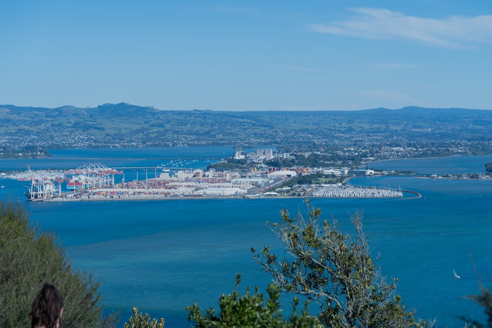 a large body of water with a city in the background