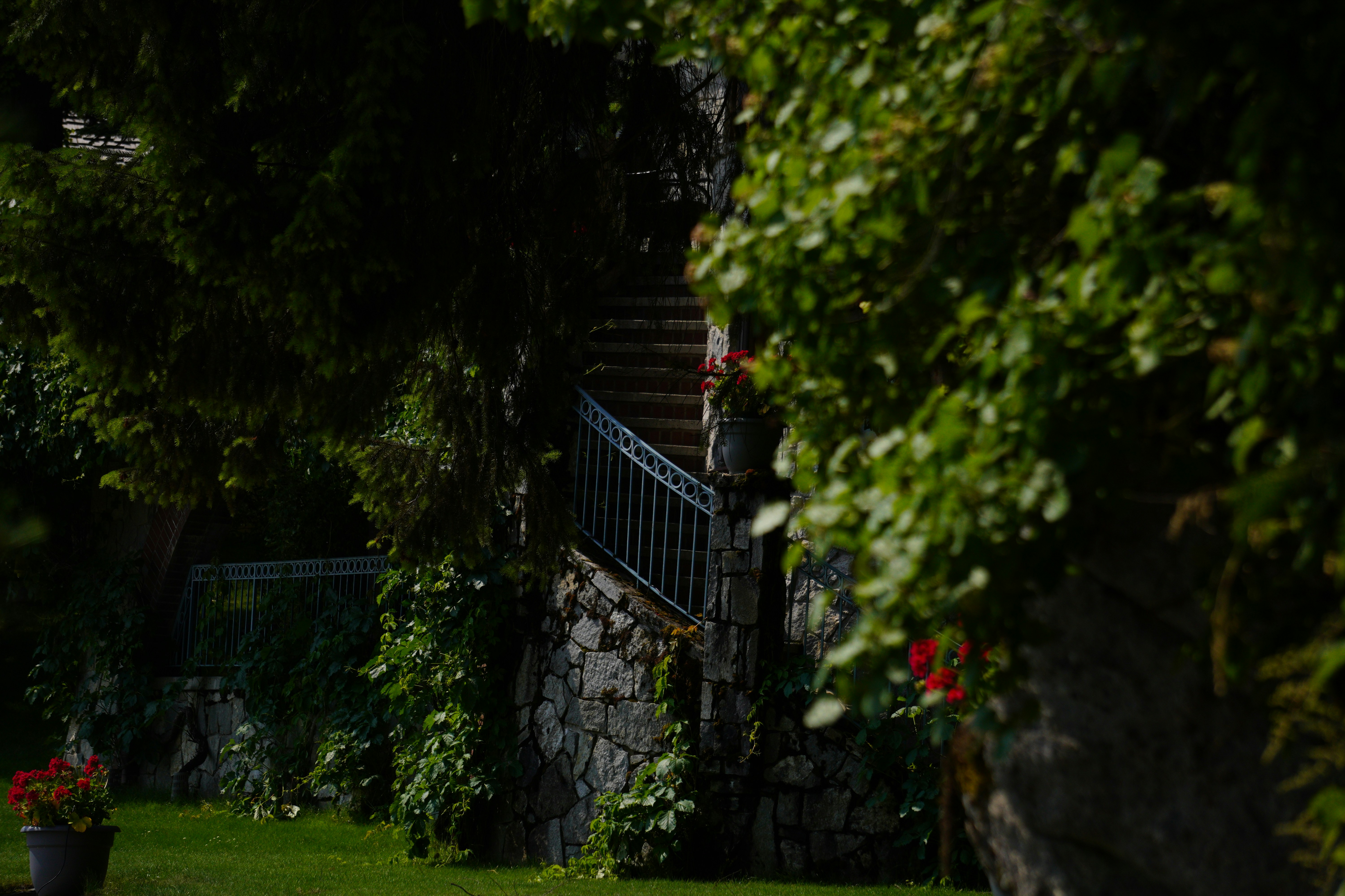 a stone building with a balcony and stairs