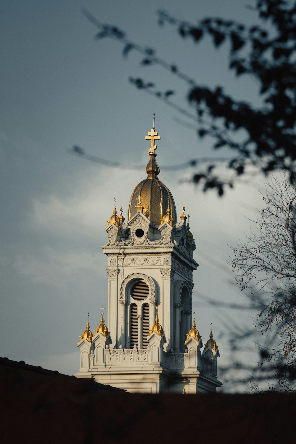 a church steeple with a cross on top