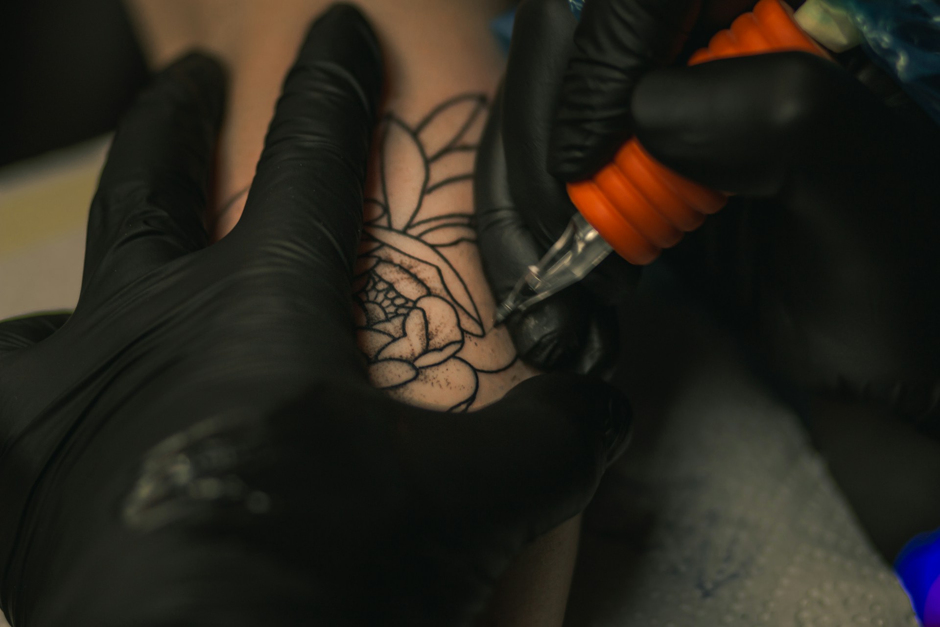 a person getting a tattoo on their arm