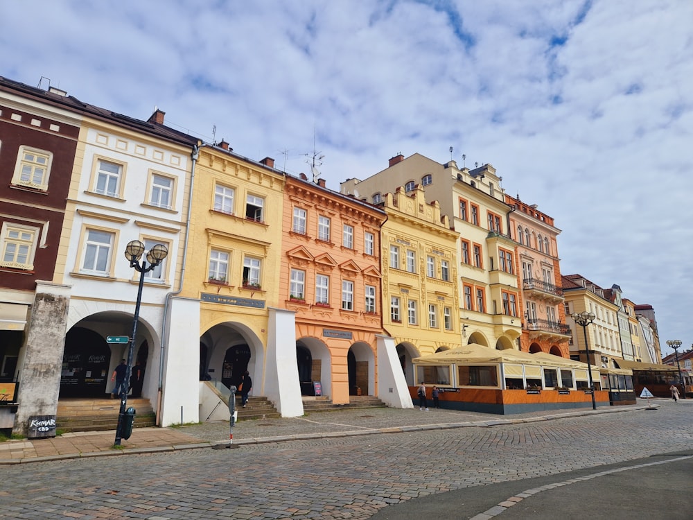 a row of buildings on a cobblestone street