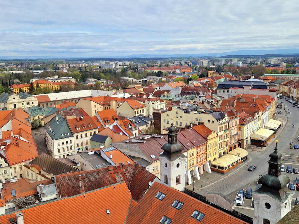 an aerial view of a city with red roofs