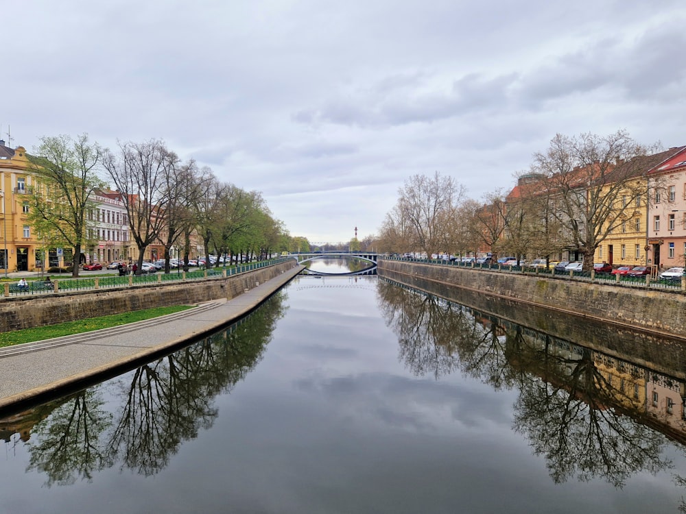 a river running through a city next to tall buildings