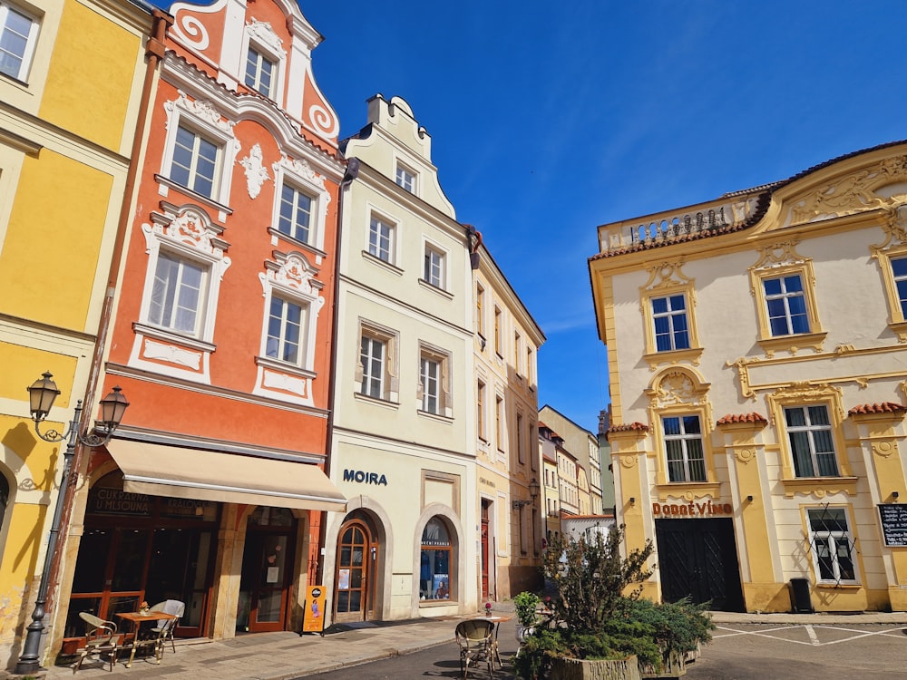 a row of buildings with a blue sky in the background