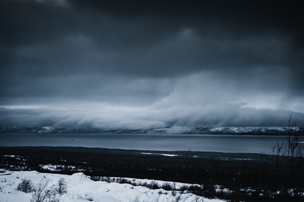 a large body of water under a cloudy sky