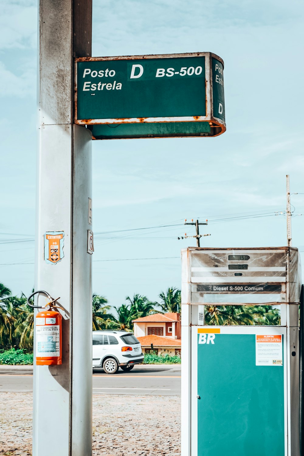 a street sign on a pole near a street