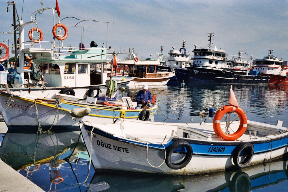 a number of small boats in a body of water