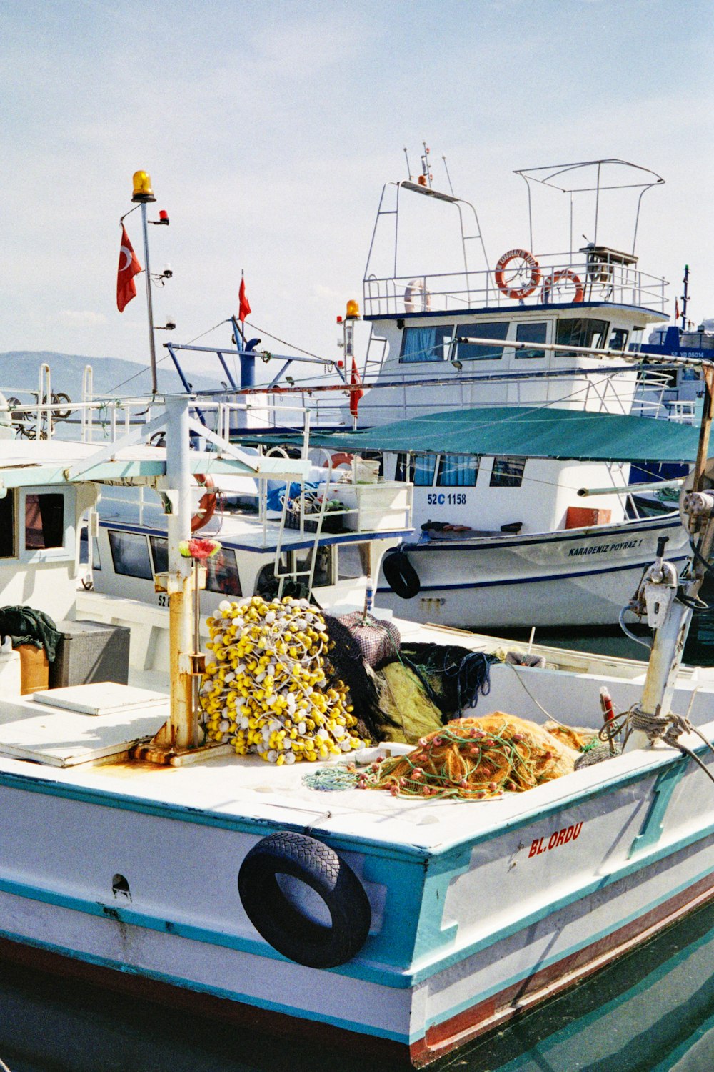 a group of boats that are sitting in the water