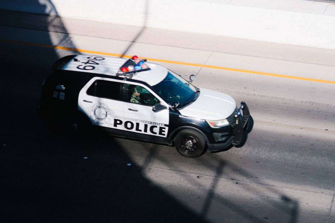 a police car parked on the side of the road,