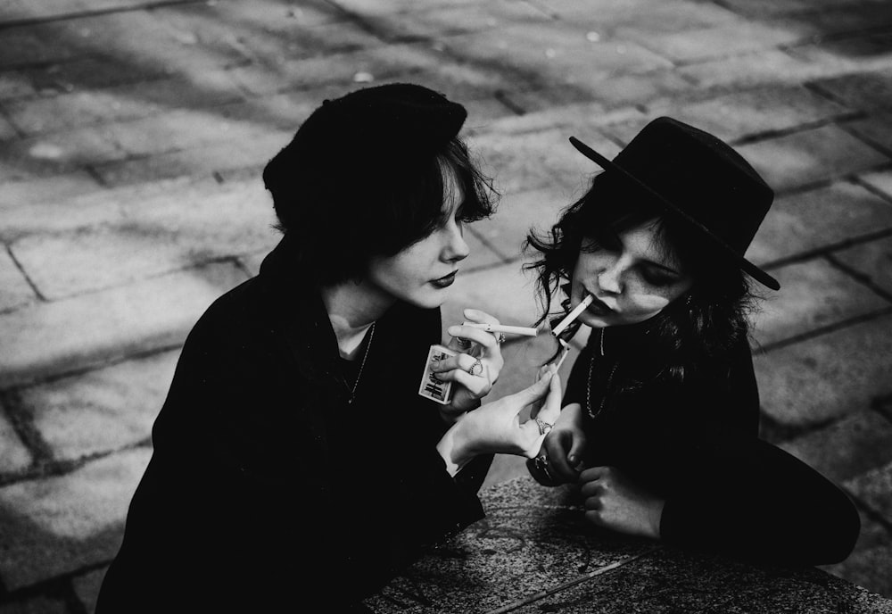 a woman and a child sitting at a table