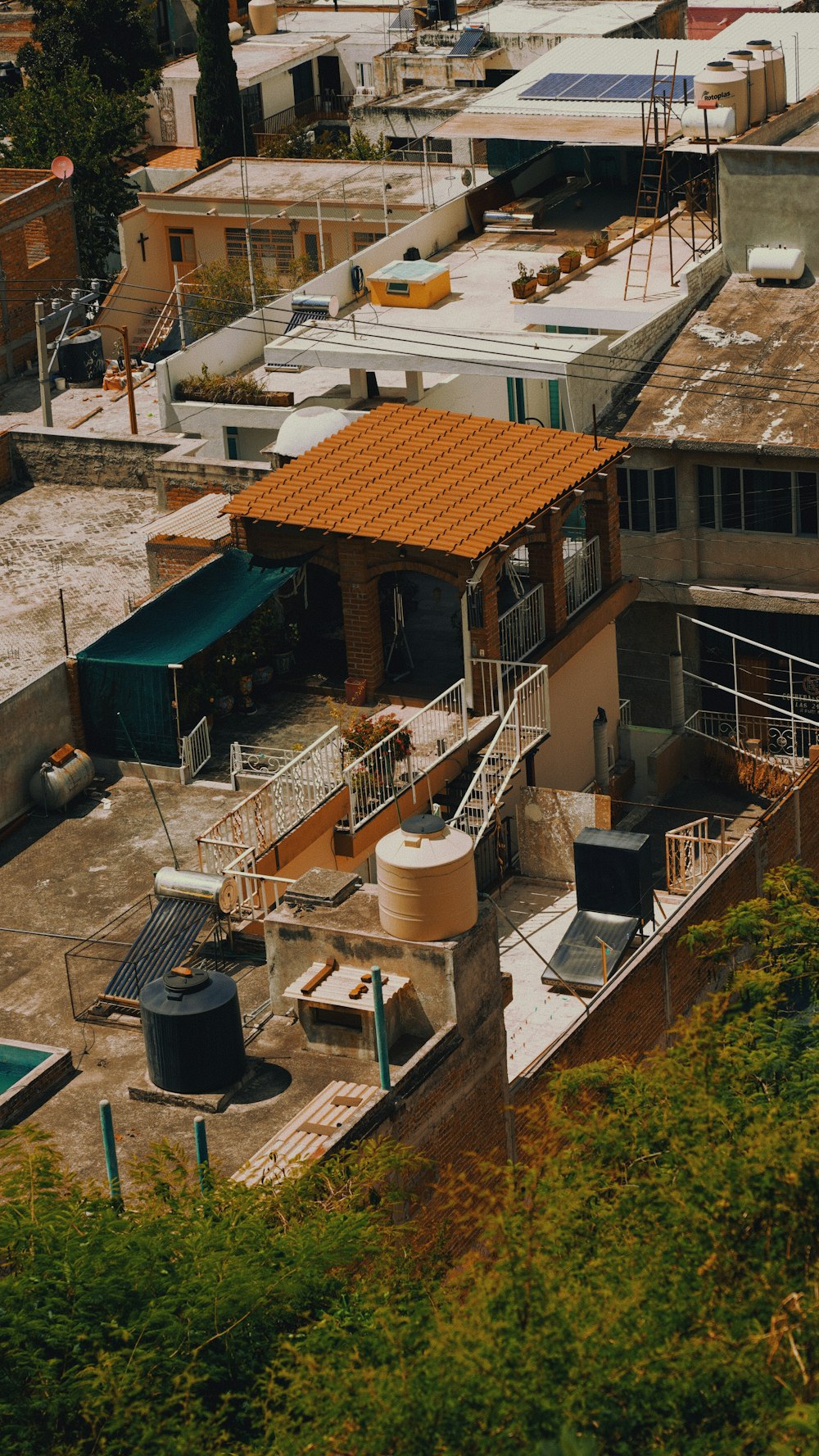 an aerial view of a rooftop with a water tank