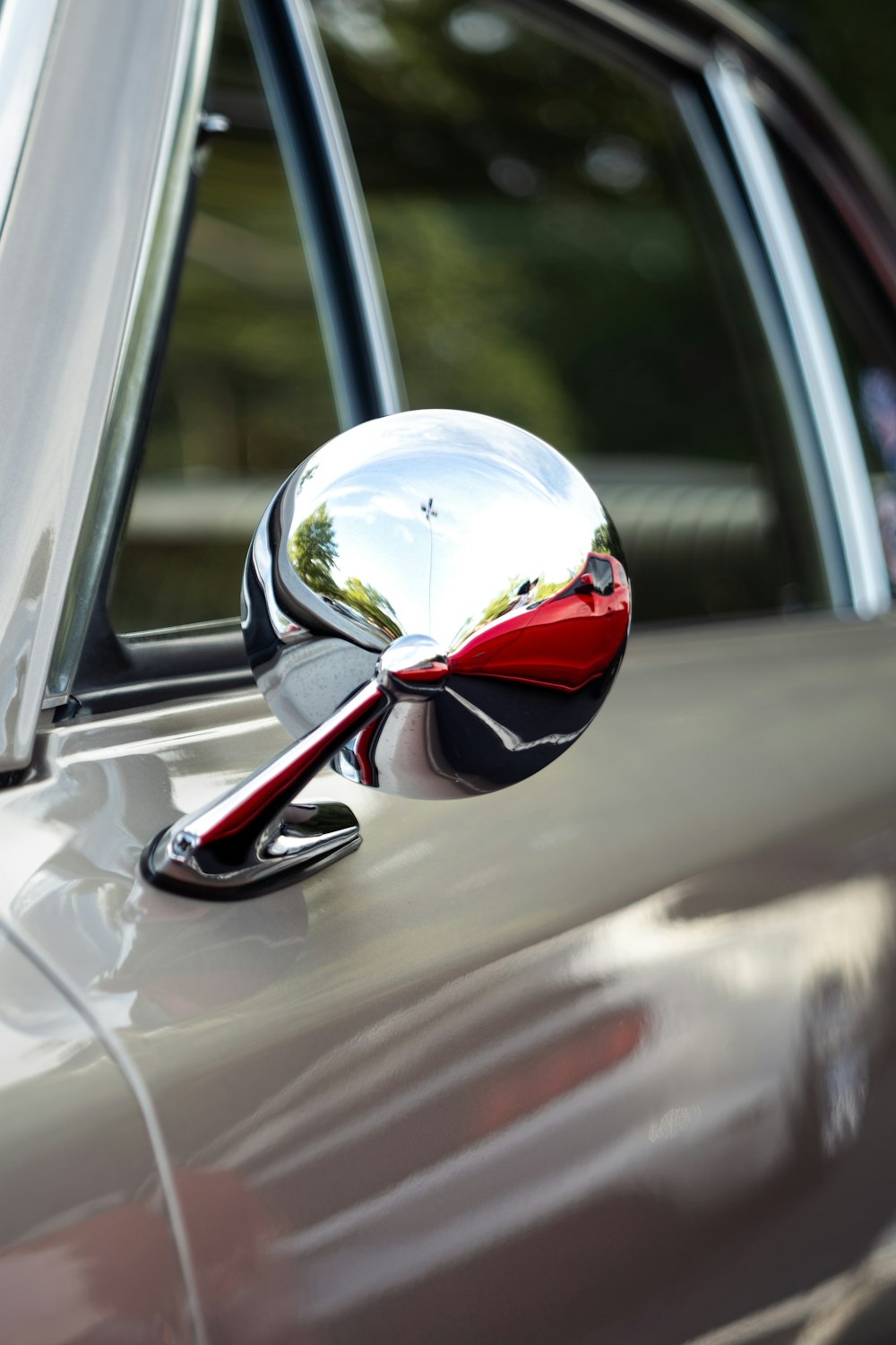 a car with a mirror on the side of it