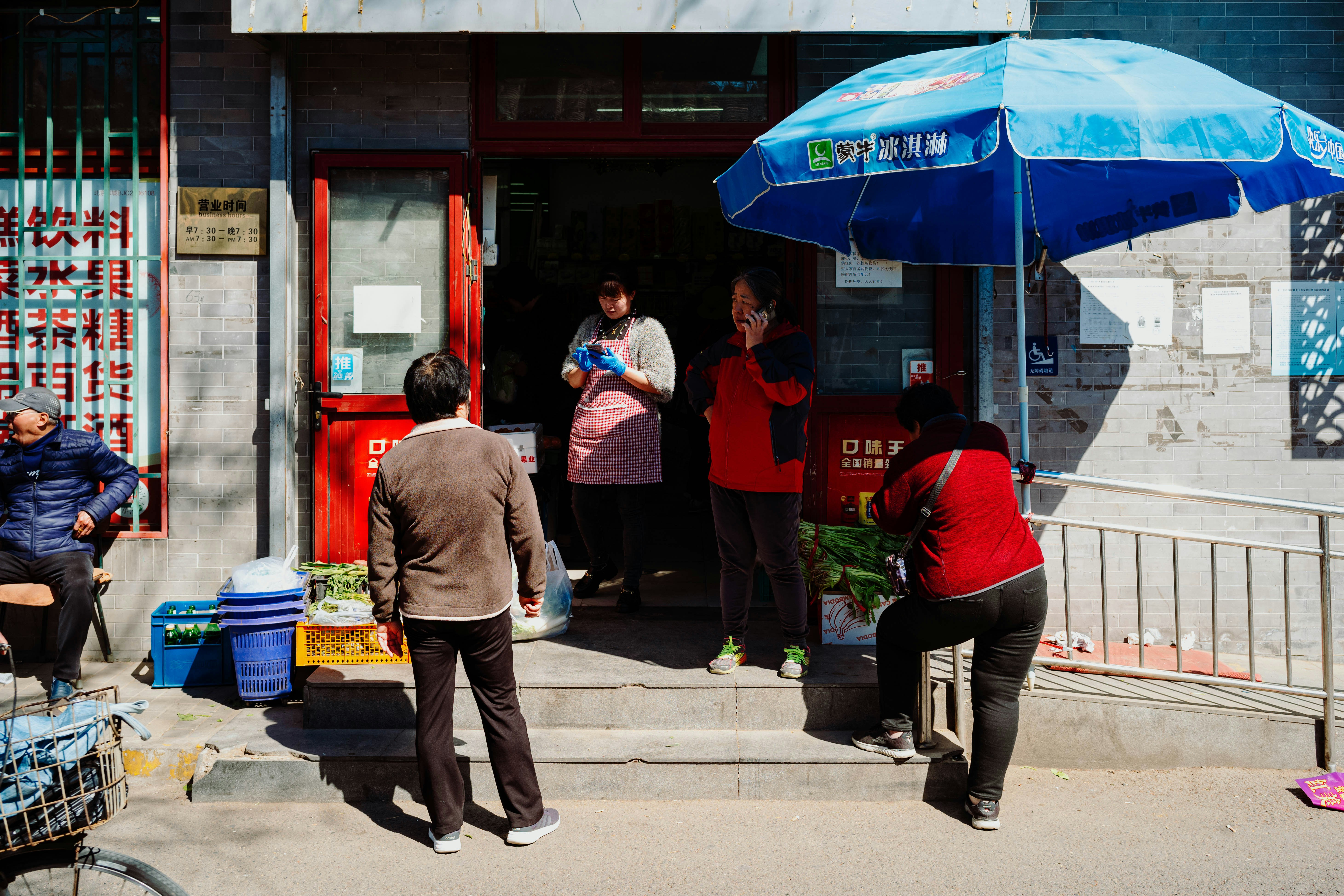a group of people standing outside of a building