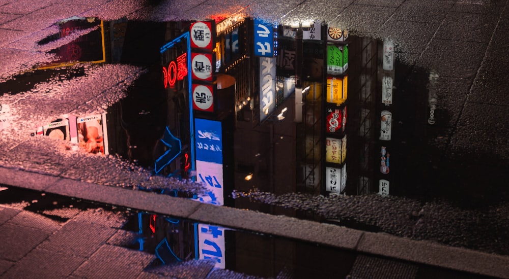 a group of street signs sitting on the side of a road