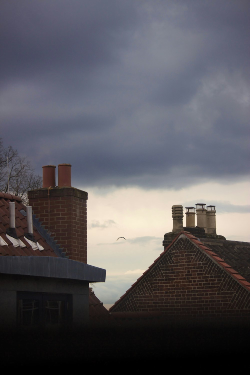 a couple of chimneys on top of a building